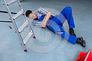 Injured Handyman Lying On Floor