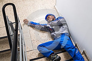 Injured Handyman Lying On Floor