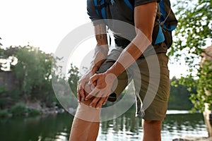 Injured knee of middle aged man during trekking