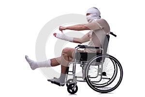 Injured man in wheel-chair isolated on white