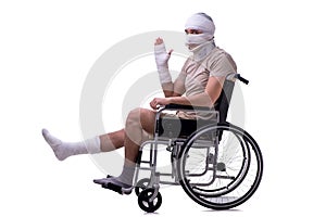 Injured man in wheel-chair isolated on white