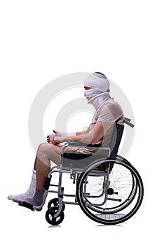 Injured man in wheel-chair isolated on white