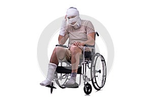 Injured man in wheel-chair isolated on white