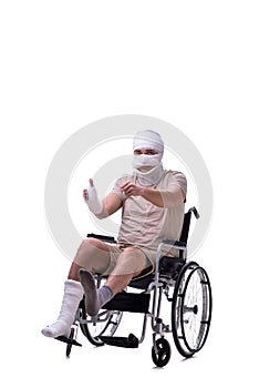 Injured man in wheel-chair isolated on white