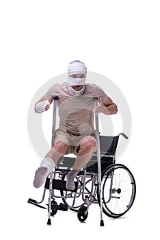 Injured man in wheel-chair isolated on white