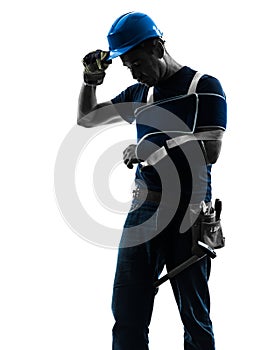 Injured manual worker man with injury brace despair silhouette