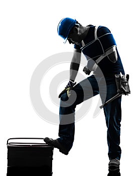 Injured manual worker man with injury brace despair silhouette