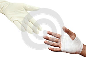 Injured painful hand with white gauze bandage