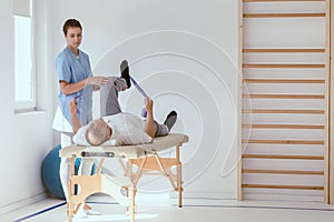 Injured patient lying on a physiotherapy bed