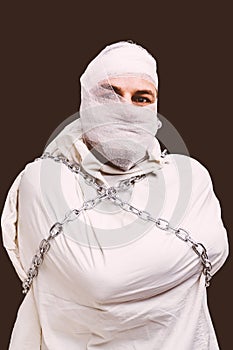 Injured patient in straitjacket