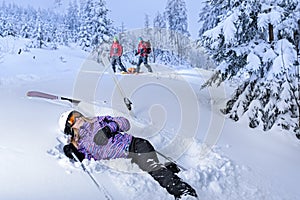 Injured skier after accident waiting for rescue