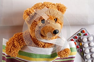 Injured teddy bear with arm in a sling