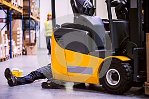 An injured worker after an accident in a warehouse.