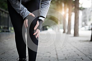 Injuries - sports running knee injury on woman.