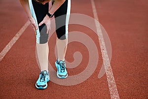 Injuries - sports running knee injury on woman.