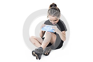 Injury girl with soccer ball isolated on white