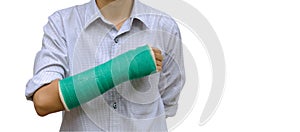 injury woman broken arm with green cast on arm standing on white