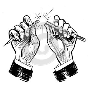 Hands breaking pencil