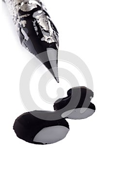 Ink pen and ink blot