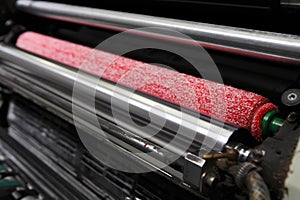Ink rollers on offset printing machine photo