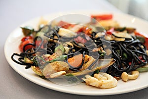 Ink squid spaghetti white sauce with ham