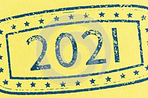 Ink stamp 2021 on yellow paper