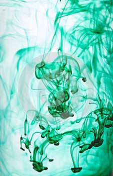 Ink swirling in water, Color drop in water photographed in motion.