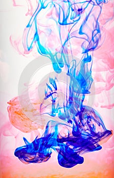 Ink swirling in water, Color drop in water photographed in motion.