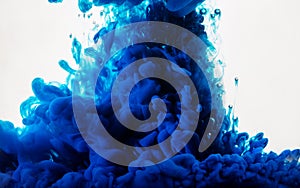 Ink in water. Abstract background. Ink swirling in water. Ink in water isolated on white background. Blue ink in water.