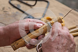 Inlaid Little and Yellow Wooden Cane in the hands of a man