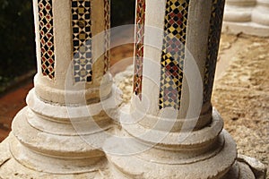 Inlaid marble mosaics on slender columns of the cloister