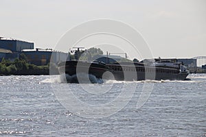 Inland freight ships on river Lek which transport seafreight to harbors in Germany and Switzerland