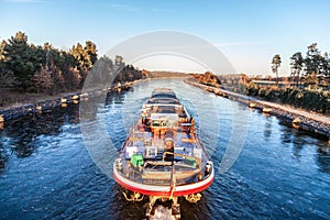 Inland vessel drives a canal