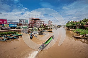 Inle Boat Station in Inle Nyaung Shwe Canal. A series of fishing boats along the river generated by Inle Lake.