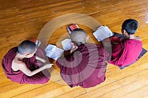 Inle, Myanmar - April 2019: Burmese monks studying in the monastery