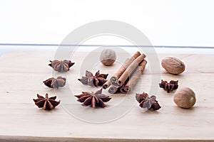 Ð¡innamon, anise and nutmeg on the table