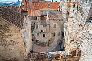 Inner courtyard, ancient stone houses with red tiled roofs, downtown buildings, Split, Croatia