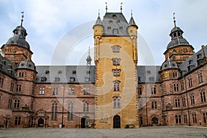Inner courtyard with Bergfried fighting tower or keep in the Schloss Johannisburg in Aschaffenburg, a famous historic city