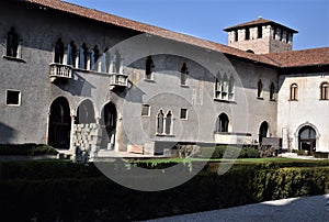 Inner courtyard of Castelvecchio with driveway and box hedge in Verona.