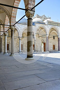Inner courtyard and corridors with its arches and frescoes in the Blue Mosque