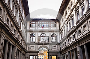 Inner courtyard of the famous Galleria degli Uffizi in Florence, Tuscany, Italy. Historical building with columns and arches.