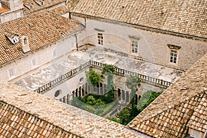 The inner courtyard of the Franciscan monastery in Dubrovnik, photographed from the walls of the old city.