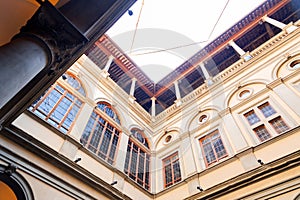 Inner courtyard of the Palazzo Strozzi, a significant historical edifice in Florence, Italy