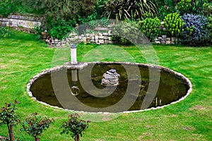 Inner garden with a small pond and a fountain in Windsor Castle