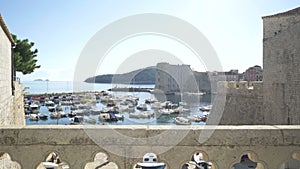 Inner gate bridge connecting Fort Revelin to Ploce Gate, with the Old Harbour and the Adriatic Sea in the background