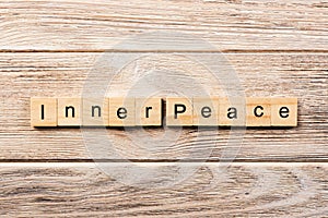 Inner peace word written on wood block. inner peace text on table, concept