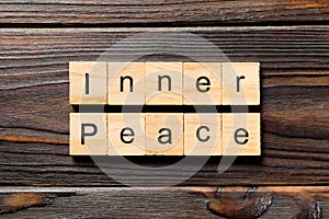 Inner peace word written on wood block. inner peace text on table, concept