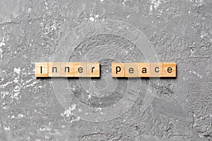 Inner peace word written on wood block. inner peace text on table, concept
