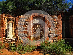 INNER ROOFLESS  STRUCTURE OF OLD FORT IN RUINS WITH VEGETATION