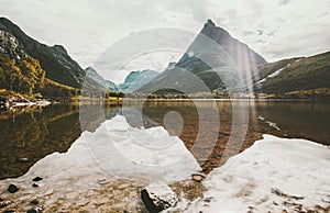 Innerdalen Mountains and lake mirror reflection Landscape in Norway